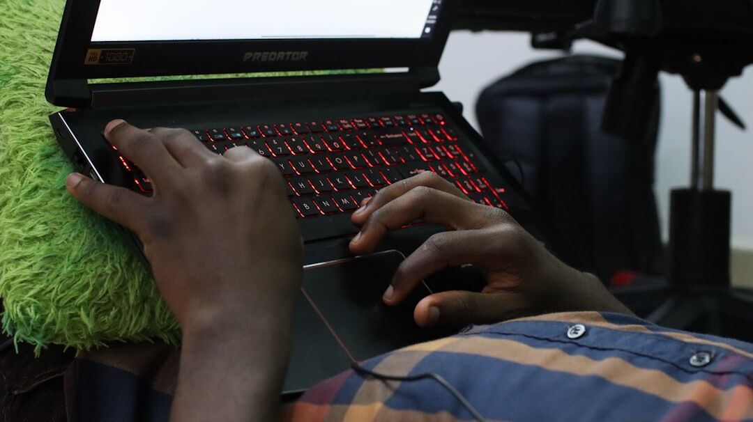 Documentary filmmaker reviewing footage on laptop