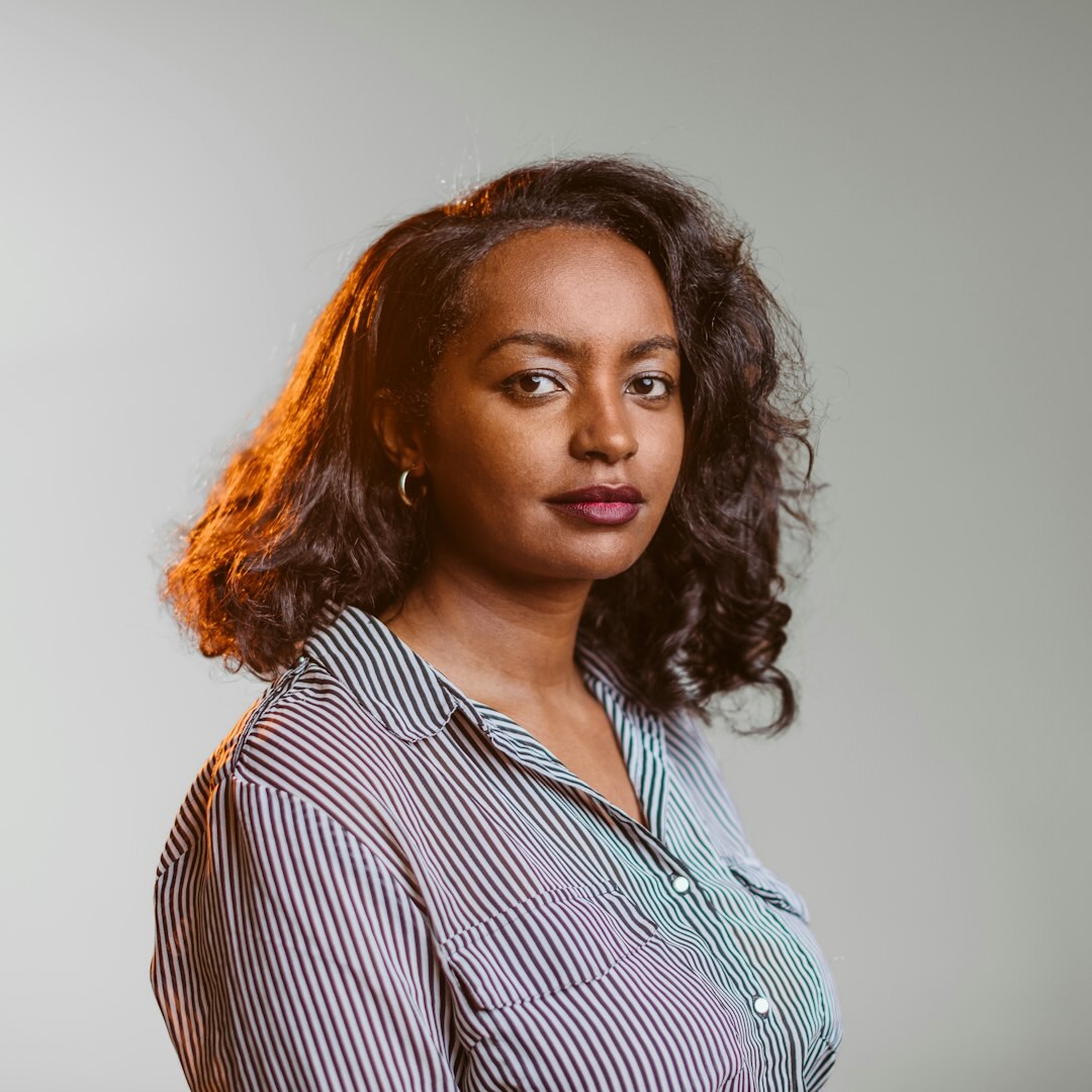 Professional woman with shoulder-length brown hair