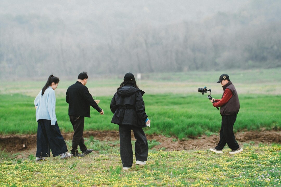 Documentary filmmaker shooting in the field
